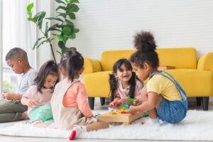 happy diverse children playing childcare center